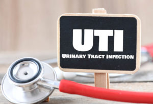 UTI Urinary Tract Infection word on a small chalk board.