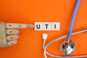 the letter of the alphabet UTI or the word abbreviation Urinary Tract Infection.
